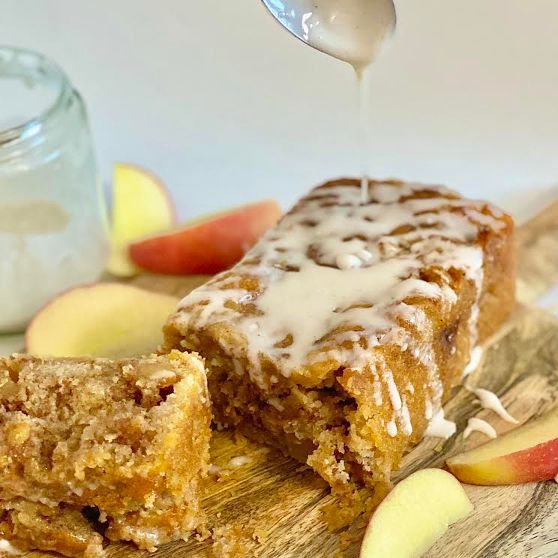 Apple Fritter Loaf Cake With Icing Drizzling With Spoon