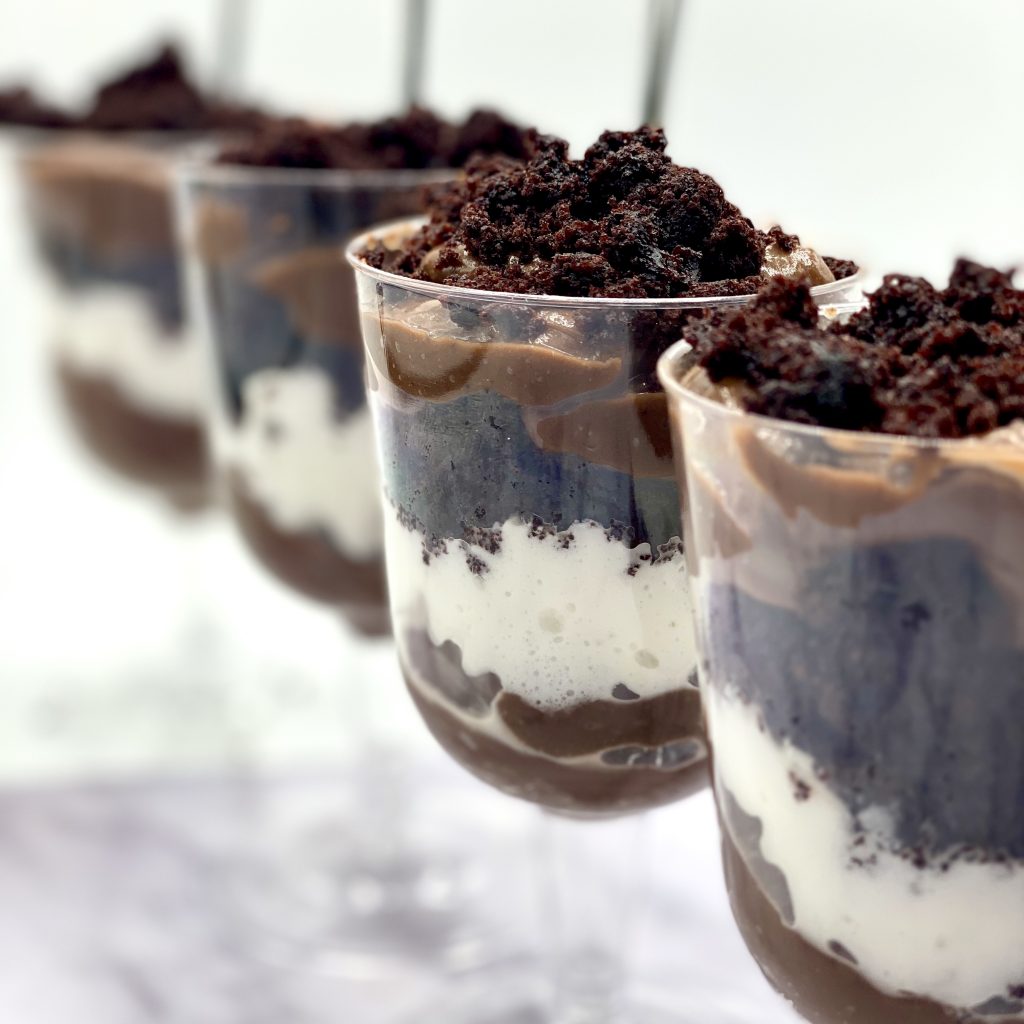 Chocolate Cake Pudding Cups Lined Up on a Surface