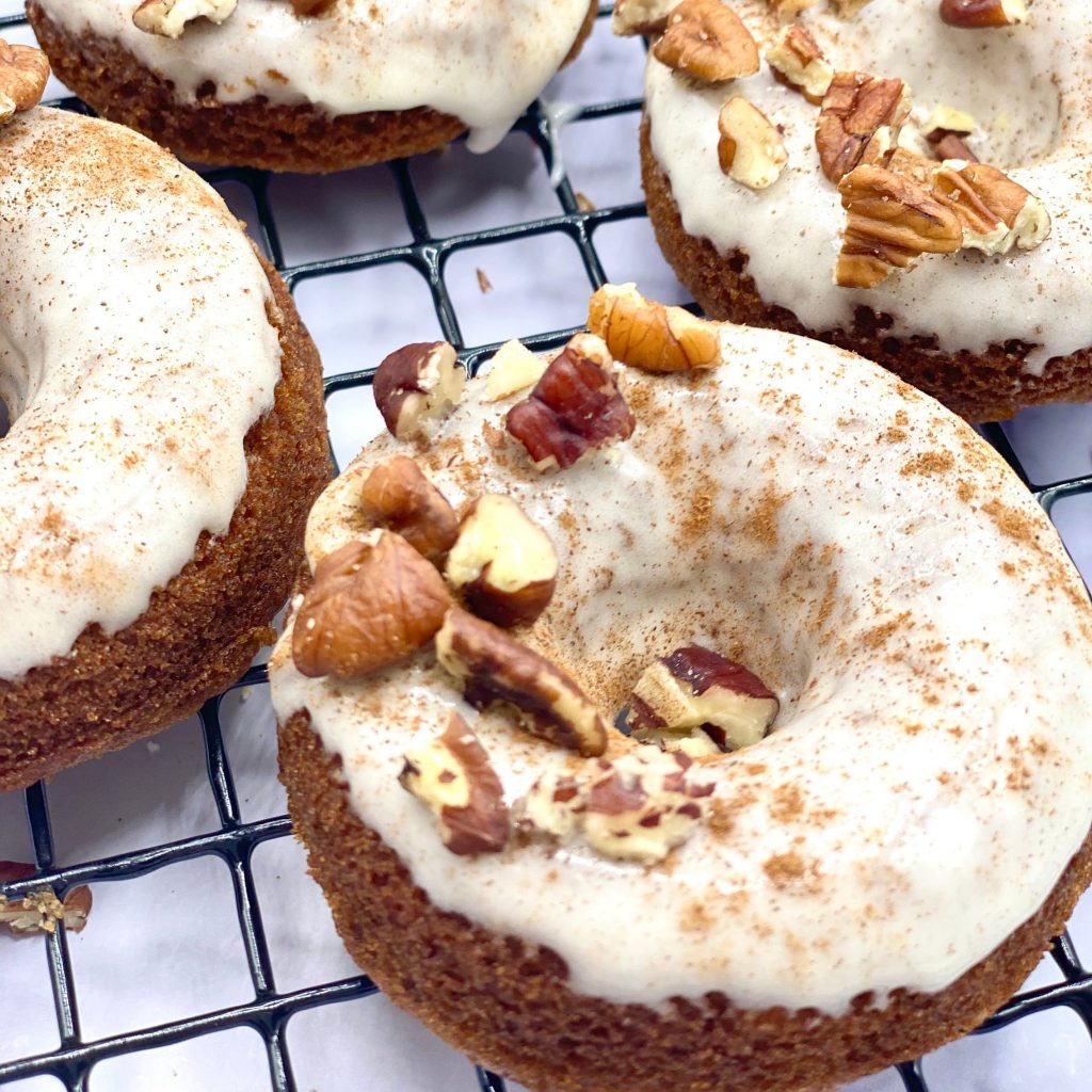 Carrot Cake Doughnuts With Icing and Walnuts