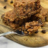 Zucchini Bread pieces and a fork on the wooden table