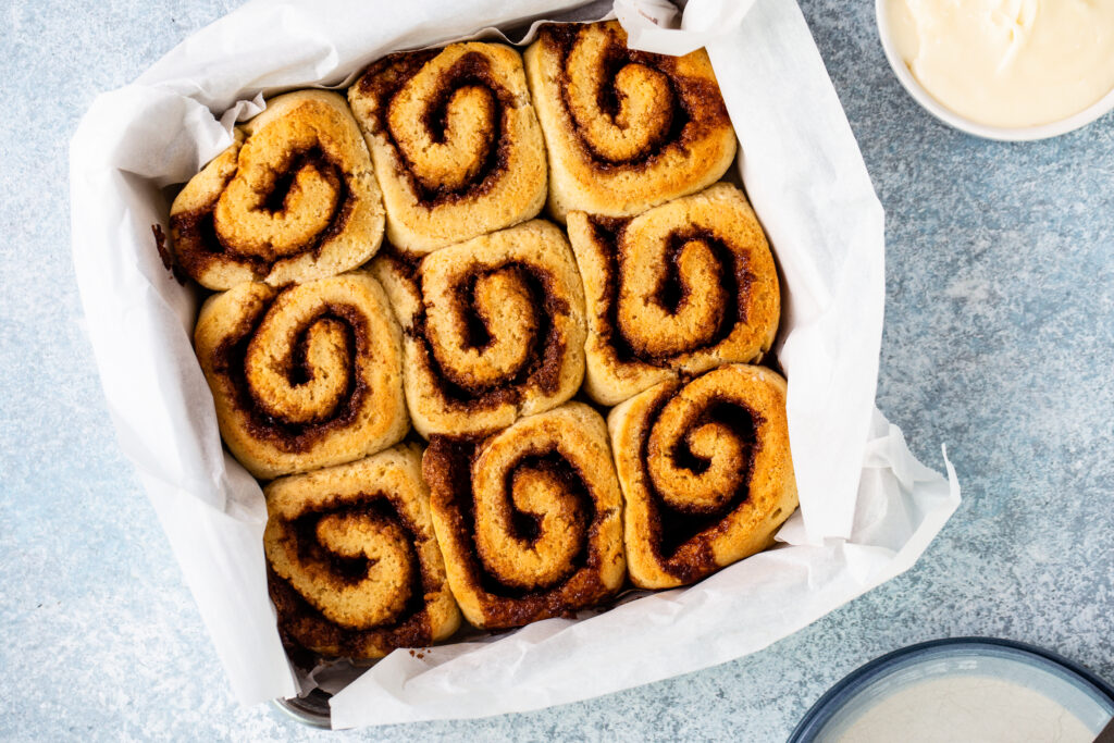 Eight Cinnamon Rolls Packed Within a Case of Tissues
