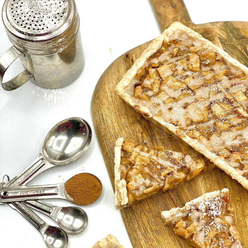 Sugar Sprinkled Square Shaped Apple Tart on a Wooden Tray